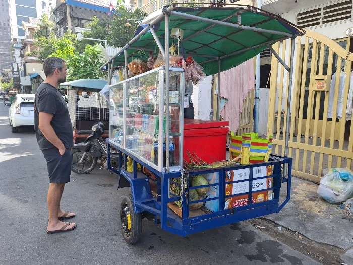 Julian standing by a food truck