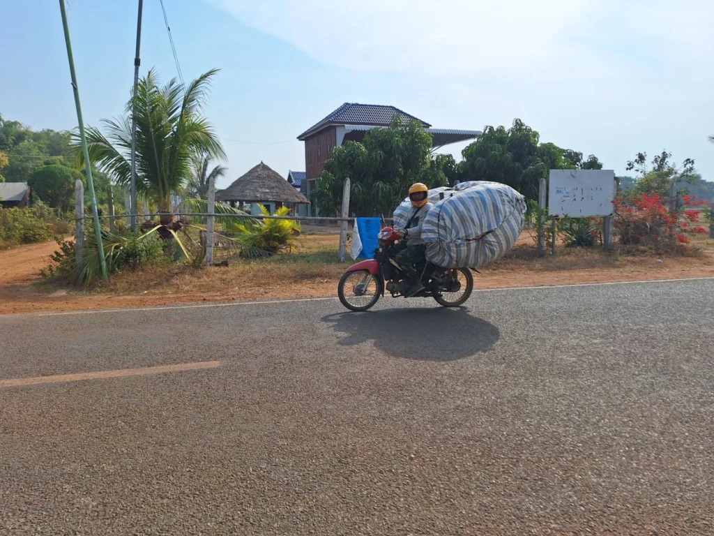 Motorbike with goods balanced across the back