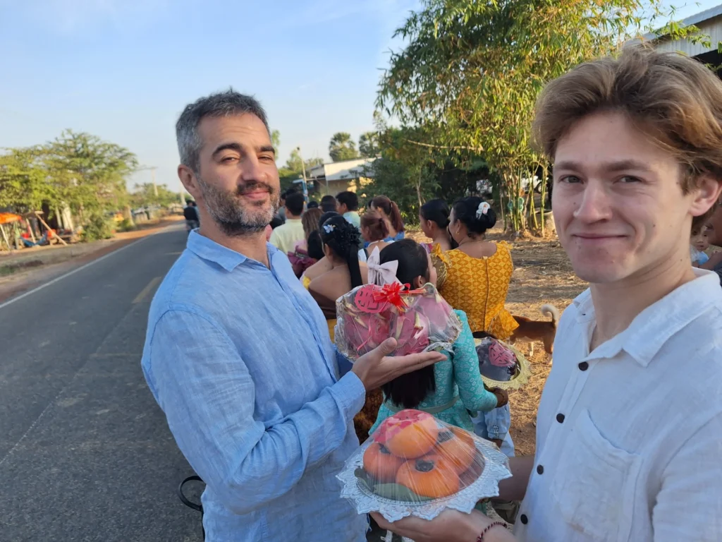 Julian and Jack armed with their fruit offerings