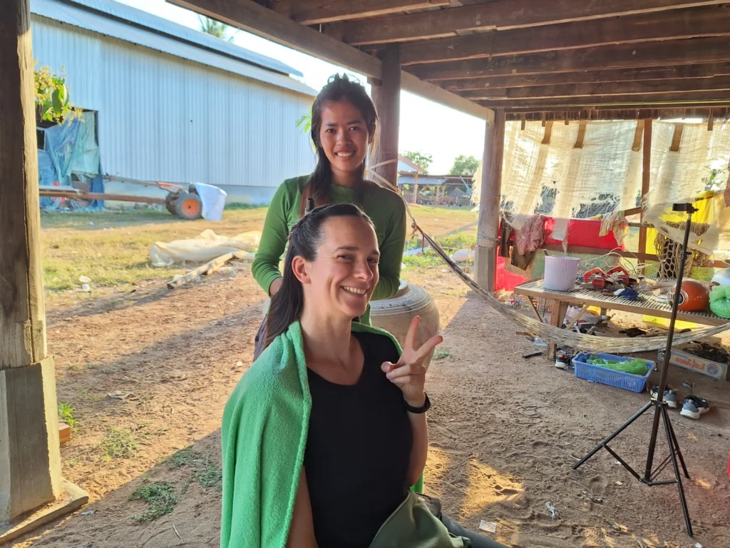 Caro having her hair styled at the neighbour's house