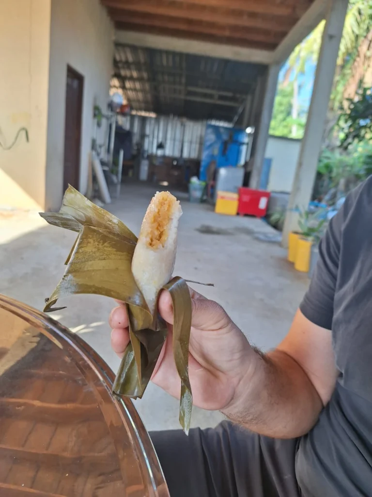 Sticky rice with a filling of bean paste wrapped in banana leaves